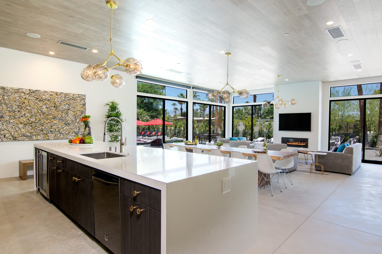 5 Palms Estate chef's kitchen with 14-foot island and pendant lights