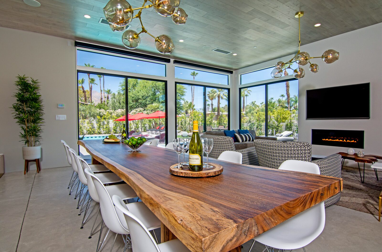 5 Palms Estate great room at dusk with dining and living