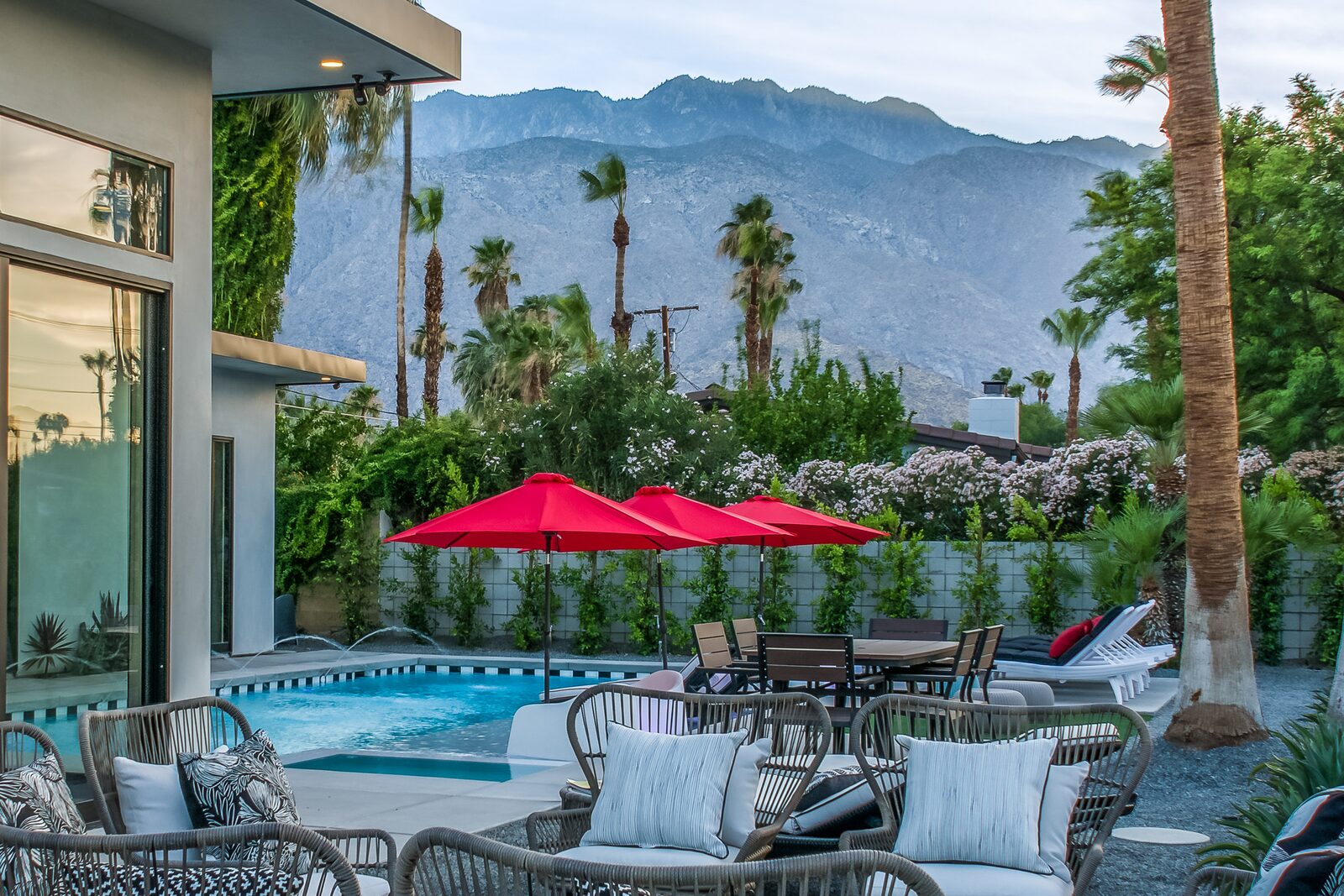 5 Palms Estate outdoor lounge with mountain view and privacy hedges