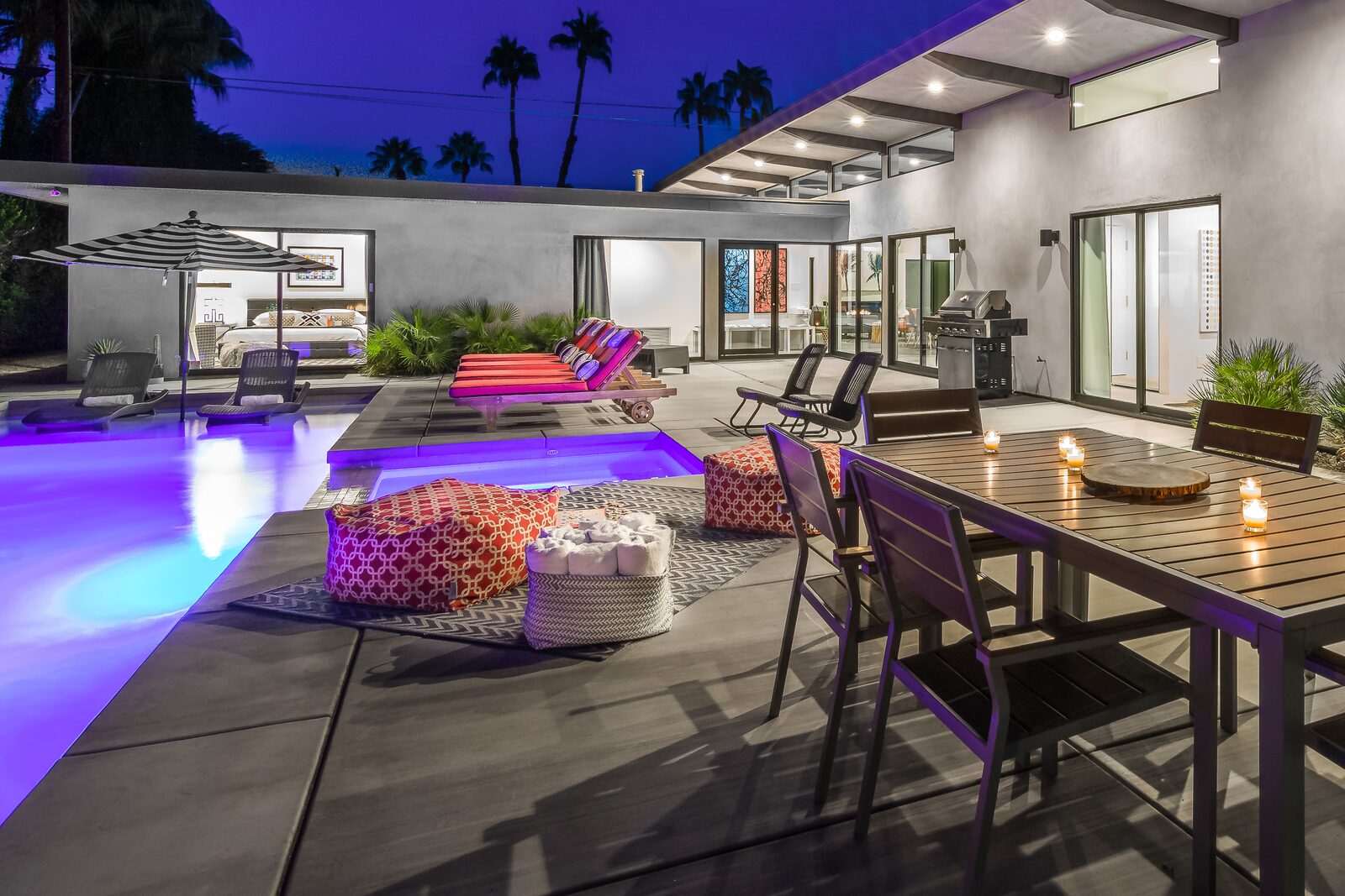 Palms at Park Villa outdoor gathering area lit for evening