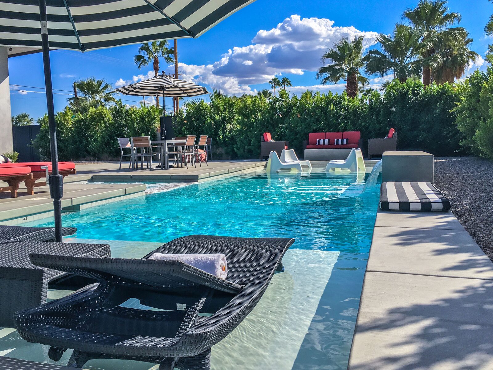 Palms at Park Villa 42-foot saltwater pool in bright daylight